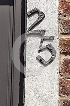 House number twenty-five 25 cast metal textured