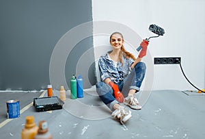 House painter sitting on the floor after work