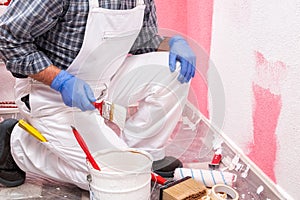 House painter worker at work in the construction site. Building