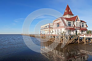 House and pier dock of the Club De Pescadores, Fisherman`s Club, Rio de la Plata, Buenos Aires, Argentina photo