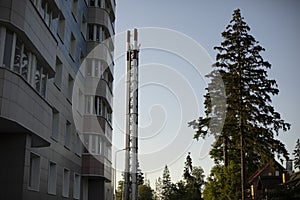 House and pipe. Boiler room near residential building. Steam pipe