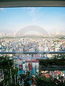 House plants at compact balcony garden of high-rise apartment aerial view dense of multistory residential home caged balcony, high