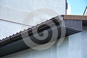 House plastic roof gutter with soffit and fascia board