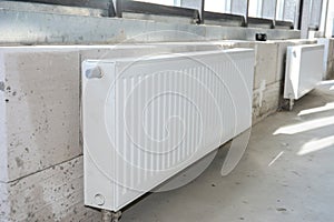 House  radiator heating. Installing radiator heating at home.  White metal radiators heating