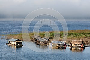 House on raft in the lake