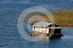 House on raft in the lake