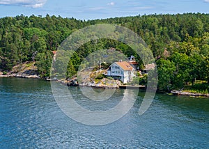 House with Red Roof Surrounded by Trees