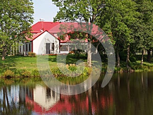 House reflected in lake