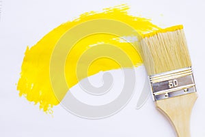 House renovation concept, colorfull paint cans and paintbrushes on wooden background