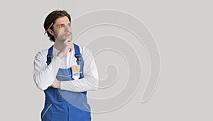 House Renovation Ideas. Portrait Of Pensive Laborer In Work Uniform