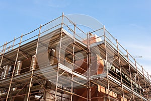 House for renovation with the scaffolding for bricklayers