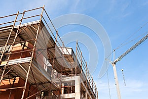 House for renovation with the scaffolding for bricklayers