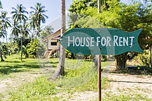 House for rent real estate sign in front of tropical house in island Koh Phangan, Thailand