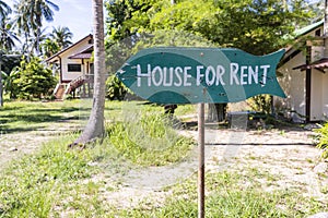 House for rent real estate sign in front of tropical house in island Koh Phangan, Thailand