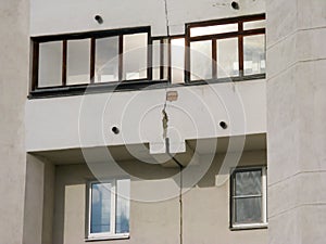The house requires repair work to eliminate cracks during shrinkage of the house after construction photo