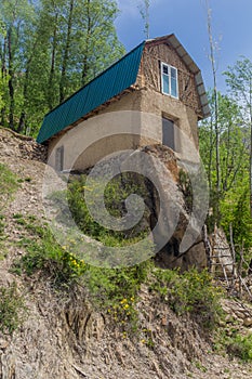 House on a rock in Marguzor Haft Kul in Fann mountains, Tajikist