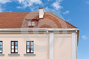 House roof with chimneys and dormer