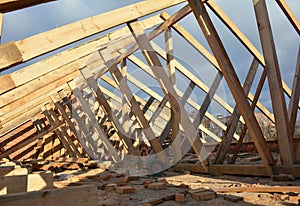 House roof framework construction  Roofing Construction with trusses frame, eaves, wooden beams photo