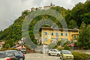 House and Sacred mountain sanctuary on background, Varallo Sesia village, Piedmont, Italy