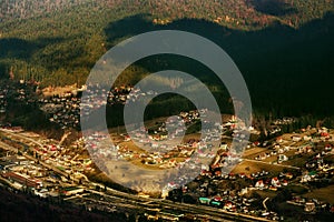 House settlement at the base of the mountains near the forest