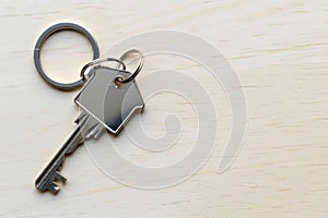 House shaped key chain with key symbolizing home ownership and security, openness acceptance image