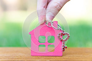 House shaped keychain with a heart shaped key