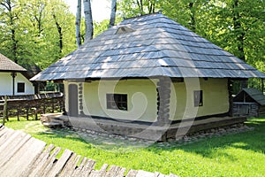 House with shingle roof in Dimitrie Gusti National Village Museum in Bucharest photo