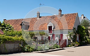 House with shutters in the picturesque village of Chedigny in the Loire Valley, central France. photo