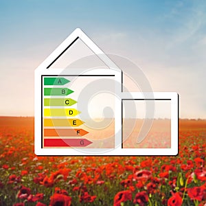 House with the sign of energy saving on a background field with