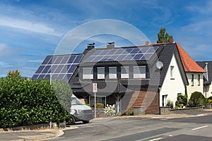 House with solar panels attached to the roof. New eco technology of electricity generation. Alternative electrical energy source