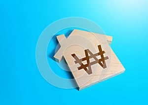 House with a south korean won symbol. Solving housing problems, deciding buy or rent real estate. Cost estimate. Search for