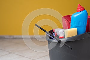 House spring cleaning items or supplies in a bucket