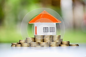 House on stack of coins,Money and house, Mortgage concept, Real estate investment, Real estate business success, Save money with