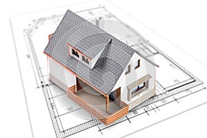 House standing on plan or blueprints