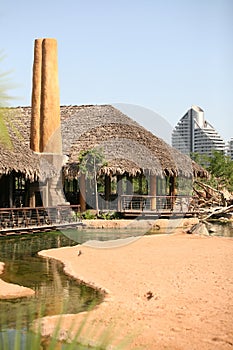 House with straw roof in Biopark photo