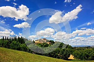 House surrounded by trees in Val d`Orcia, Tuscany, Italy