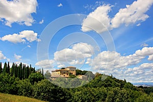 House surrounded by trees in Val d`Orcia, Tuscany, Italy