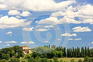 House surrounded by trees in Val d`Orcia, Tuscany, Italy