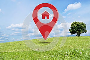 House symbol with pin icon on earth and green grass in real estate sale or real estate