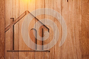 House symbol on wooden plank background