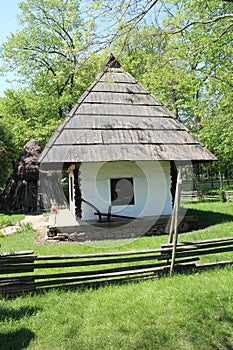 House with thatched roof in Dimitrie Gusti National Village Museum in Bucharest