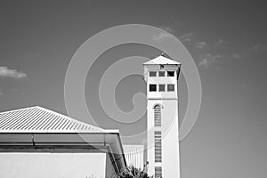 House with tower on sunny blue sky. Architecture structure and design concept