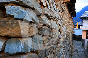 house of traditional rock wall in a Gurung village in Ghandruk town, nepal