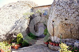 House between two boulders