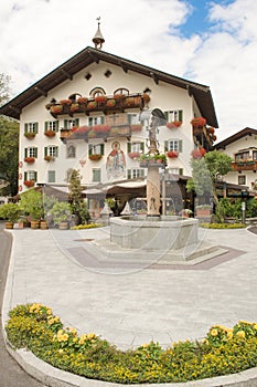 House in Tyrol with water well and beutiful flowers