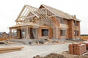 Isolated house under construction on white