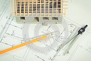 House under construction and accessories for drawing on electrical diagrams for project, building home concept