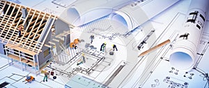 House under construction on blueprints