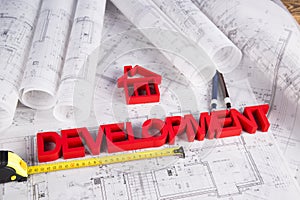 House under construction, blueprints concept