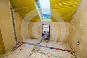 House under construction with fresh screed and plaster